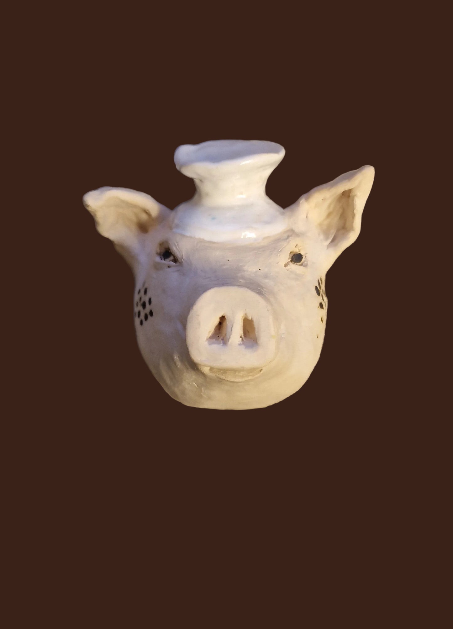 Kokkegrisen i keramikk