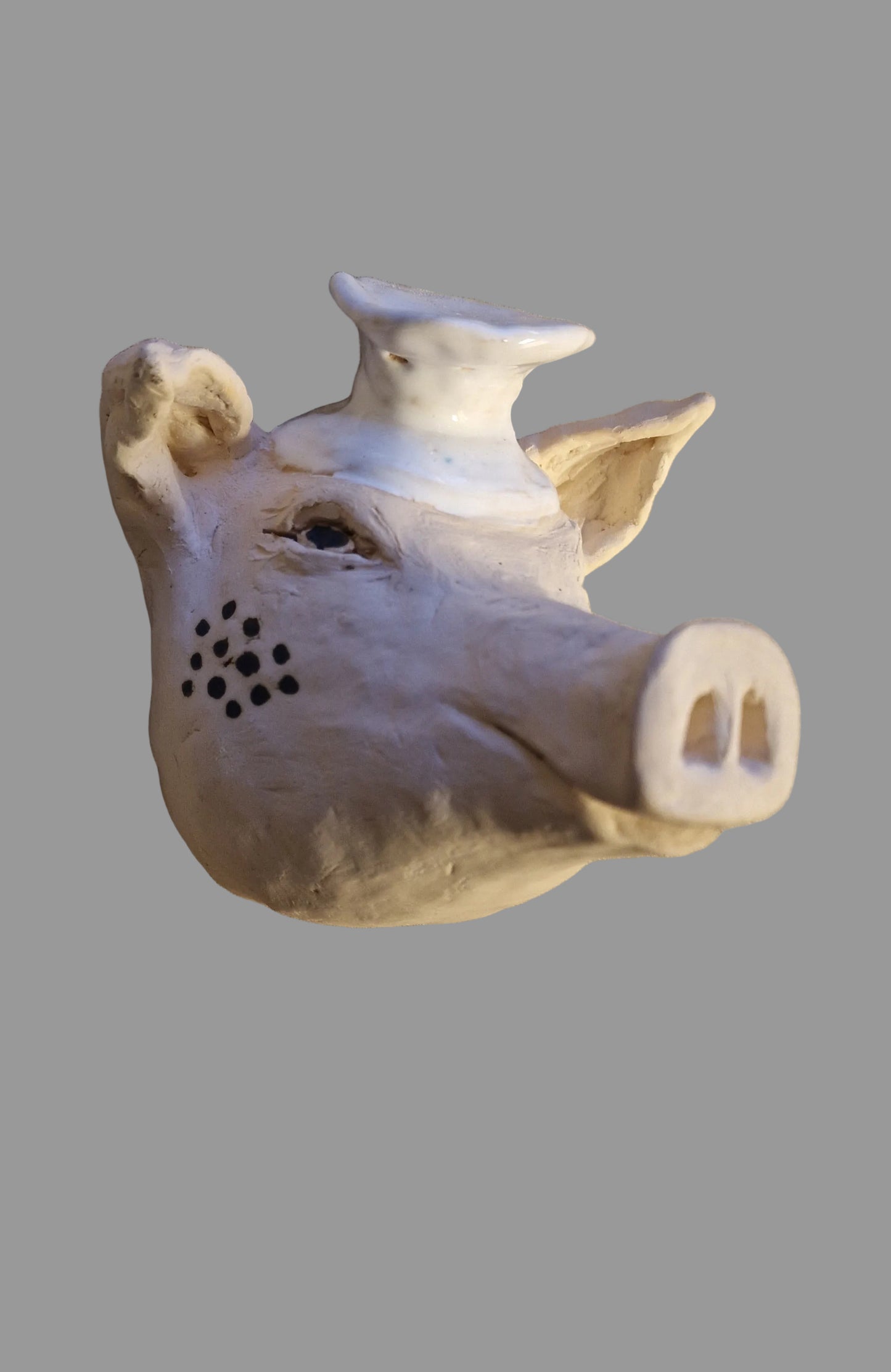 Kokkegrisen i keramikk